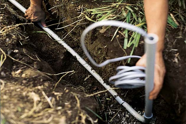 Install the conduit in the posthole