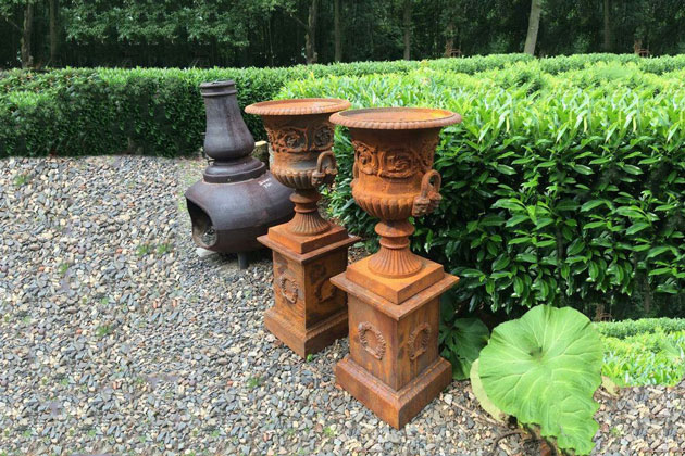 Cast iron urn planters with patina
